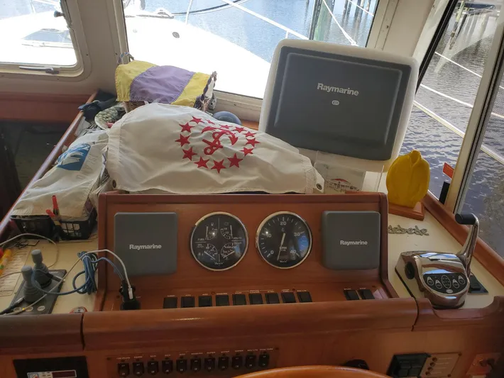 Angels Only Yacht Photos Pics 2007 Mainship 400 Trawler helm with Raymarine electronics and nautical equipment.