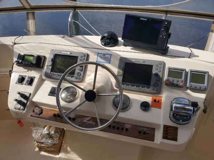 Angels Only Yacht Photos Pics 2007 Mainship 400 Trawler helm with navigation instruments and steering wheel.