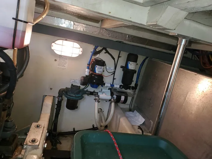 Angels Only Yacht Photos Pics Engine room of 2007 Mainship 400 Trawler with visible mechanical components and wiring.