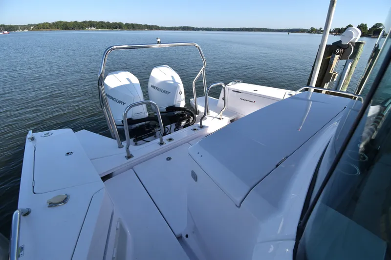 Sundog Yacht Photos Pics 2023 Axopar 37XC Wet Bar with dual Mercury engines on a serene lake.