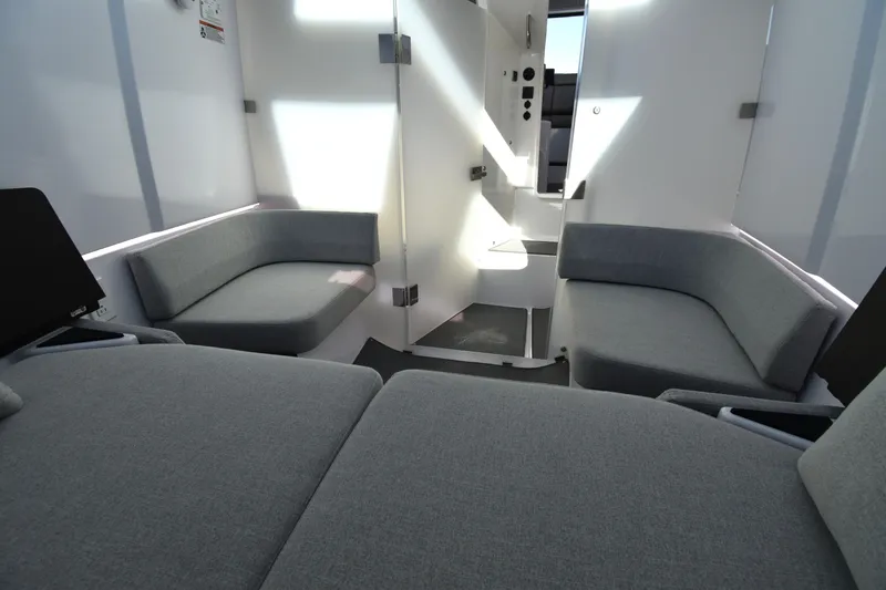 Sundog Yacht Photos Pics 2023 Axopar 37XC Wet Bar interior with modern gray seating and sleek design.