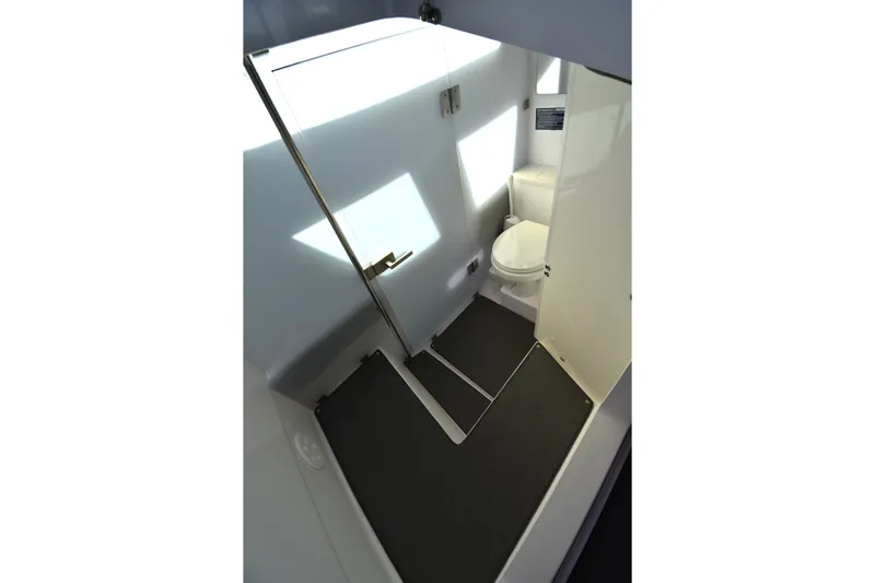 Sundog Yacht Photos Pics 2023 Axopar 37XC Wet Bar bathroom interior with modern design and sleek fixtures.