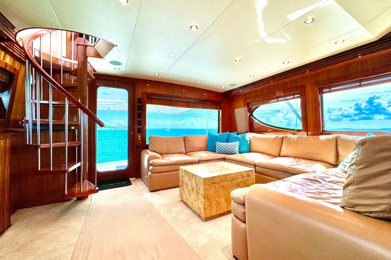 Red Queen Yacht Photos Pics Luxurious interior of 2008 Hatteras 64 Convertible yacht with plush seating and ocean view.