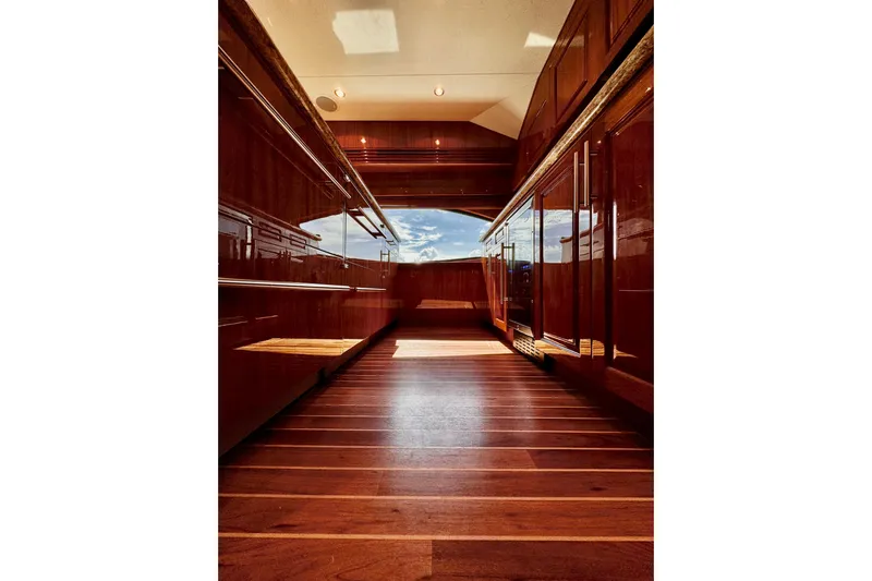 Red Queen Yacht Photos Pics Luxurious interior of 2008 Hatteras 64 Convertible yacht with polished wood finishes.