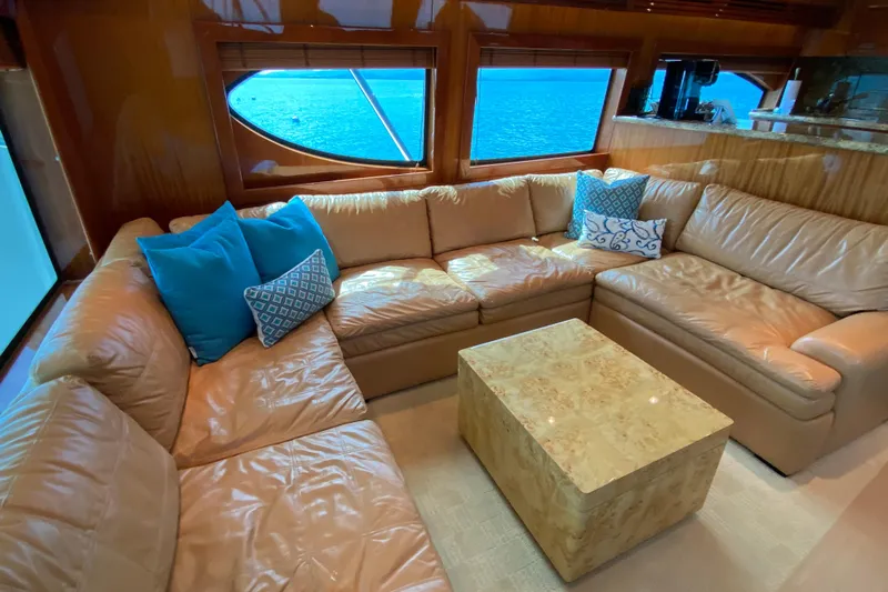 Red Queen Yacht Photos Pics Luxurious interior of 2008 Hatteras 64 Convertible yacht with leather seating and ocean view.