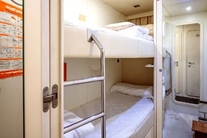  Yacht Photos Pics Bunk beds in a 2009 Sunseeker 90 yacht cabin, featuring a compact and cozy design.