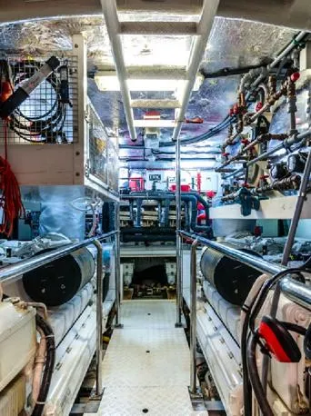  Yacht Photos Pics Engine room of a 2009 Sunseeker 90 yacht, showcasing complex machinery and equipment.