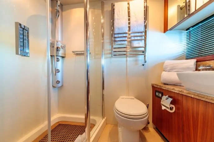  Yacht Photos Pics Luxurious bathroom in a 2009 Sunseeker 90 yacht with modern fixtures and elegant design.