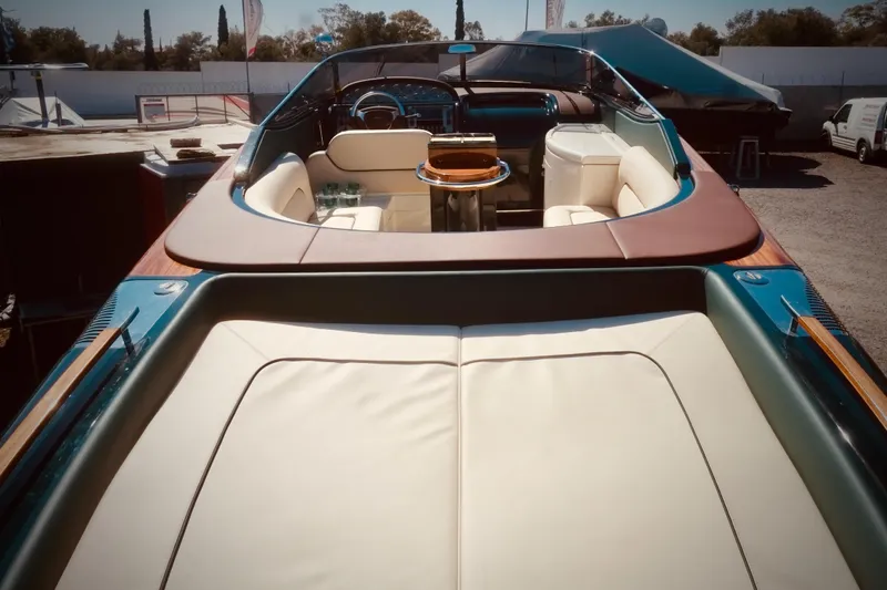  Yacht Photos Pics 2003 Riva Aquariva 33 luxury boat interior with leather seating and wooden accents.