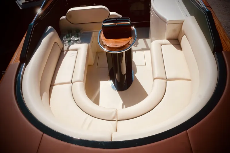  Yacht Photos Pics Luxurious seating area on a 2003 Riva Aquariva 33 boat with elegant cream upholstery.