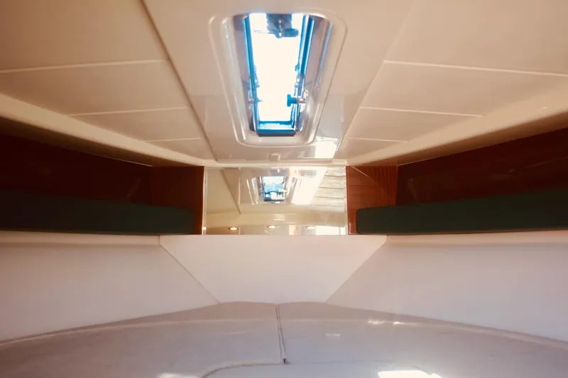 Yacht Photos Pics Interior view of 2003 Riva Aquariva 33 yacht, featuring sleek design and skylight.