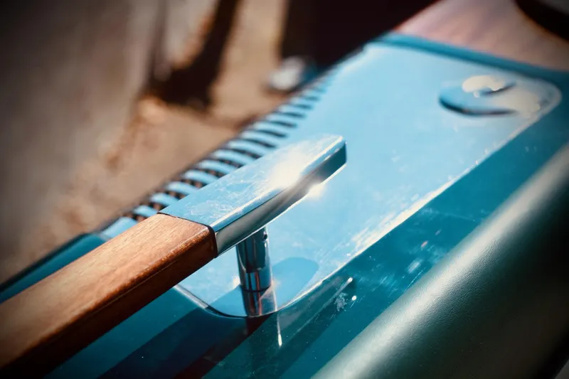  Yacht Photos Pics Close-up of a 2003 Riva Aquariva 33 boat detail with polished wood and metal accents.
