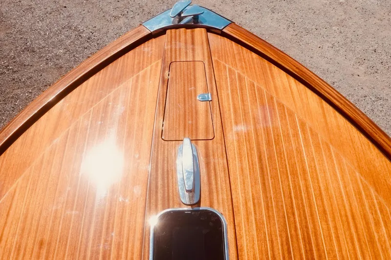  Yacht Photos Pics Bow of 2003 Riva Aquariva 33 with polished wood finish and chrome details.