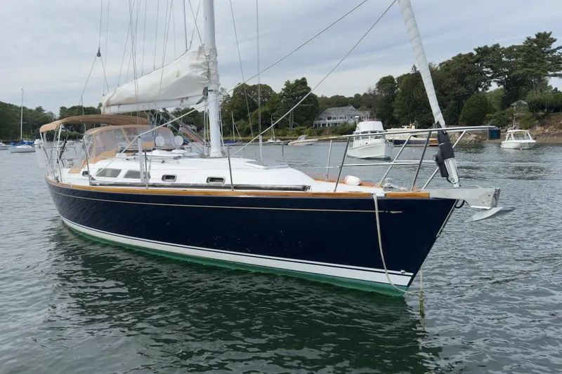 Finesse Yacht Photos Pics 2005 Sabre 386 sailboat anchored in a scenic harbor with surrounding boats.