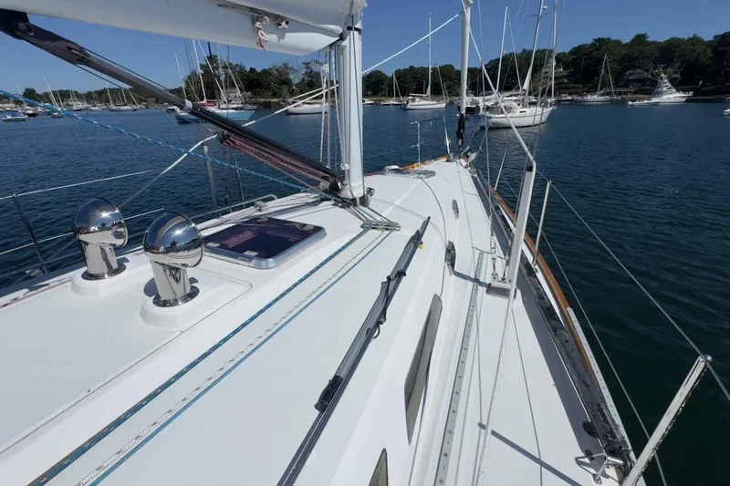 Finesse Yacht Photos Pics Sailboat deck view of 2005 Sabre 386, moored in a scenic harbor.
