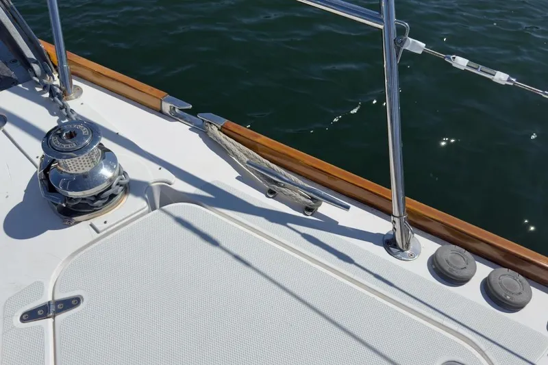 Finesse Yacht Photos Pics Deck of 2005 Sabre 386 sailboat with winch and railing, overlooking water.