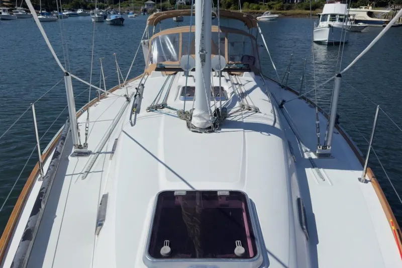 Finesse Yacht Photos Pics 2005 Sabre 386 sailboat deck view in a marina setting.