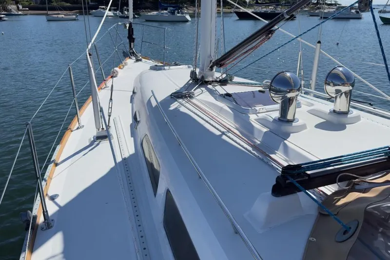 Finesse Yacht Photos Pics 2005 Sabre 386 sailboat deck view in a marina setting.