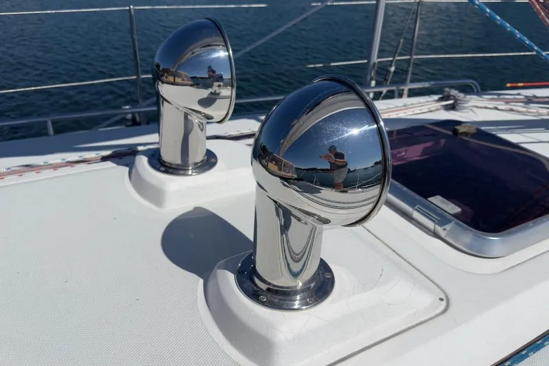 Finesse Yacht Photos Pics Chrome vents on 2005 Sabre 386 yacht deck reflecting surroundings.