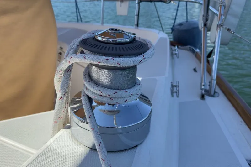 Finesse Yacht Photos Pics Sailboat winch with rope on 2005 Sabre 386 deck, near water.