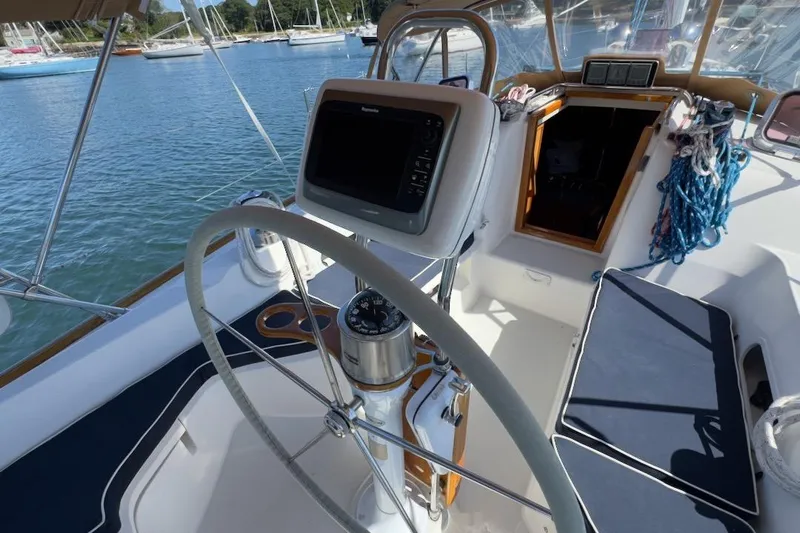 Finesse Yacht Photos Pics Cockpit of 2005 Sabre 386 sailboat with steering wheel and navigation equipment.
