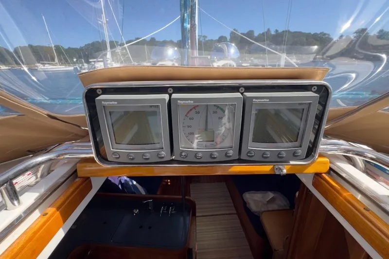 Finesse Yacht Photos Pics Cockpit of 2005 Sabre 386 sailboat with navigation instruments and clear canopy view.