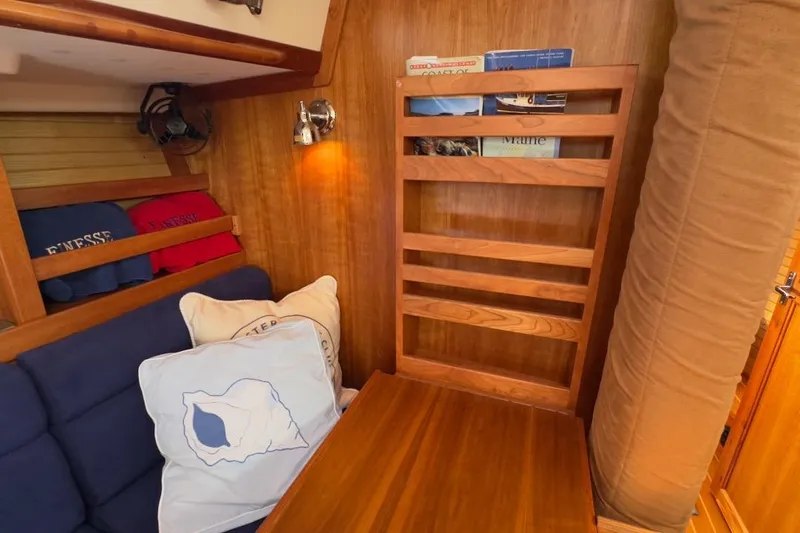 Finesse Yacht Photos Pics Cozy interior of 2005 Sabre 386 sailboat with wooden accents and nautical decor.