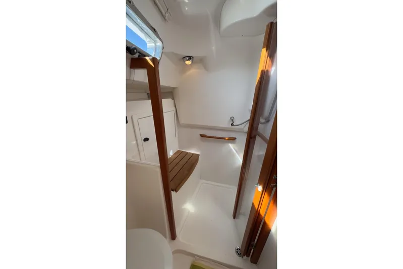 Finesse Yacht Photos Pics 2005 Sabre 386 yacht interior with wooden accents and compact design.