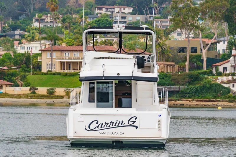 Carrin G Yacht Photos Pics 2008 Navigator 4600 Pilothouse yacht in San Diego waters, scenic coastal backdrop.
