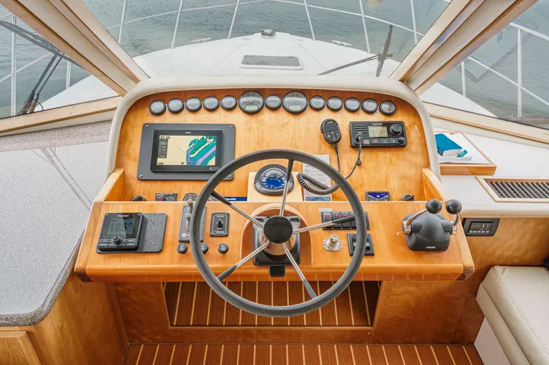 Carrin G Yacht Photos Pics 2008 Navigator 4600 Pilothouse helm with navigation instruments and steering wheel.