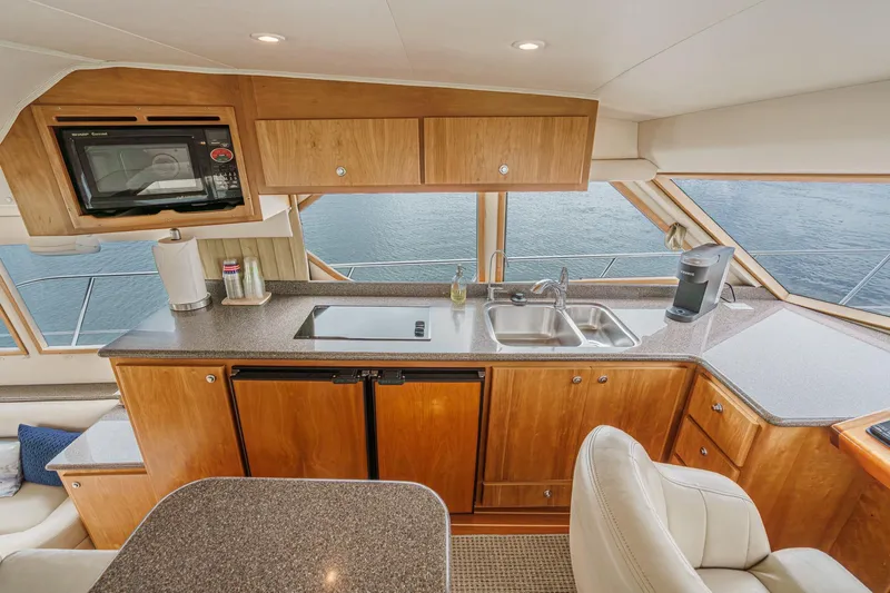 Carrin G Yacht Photos Pics Luxurious 2008 Navigator 4600 Pilothouse yacht kitchen with modern appliances and ocean view.