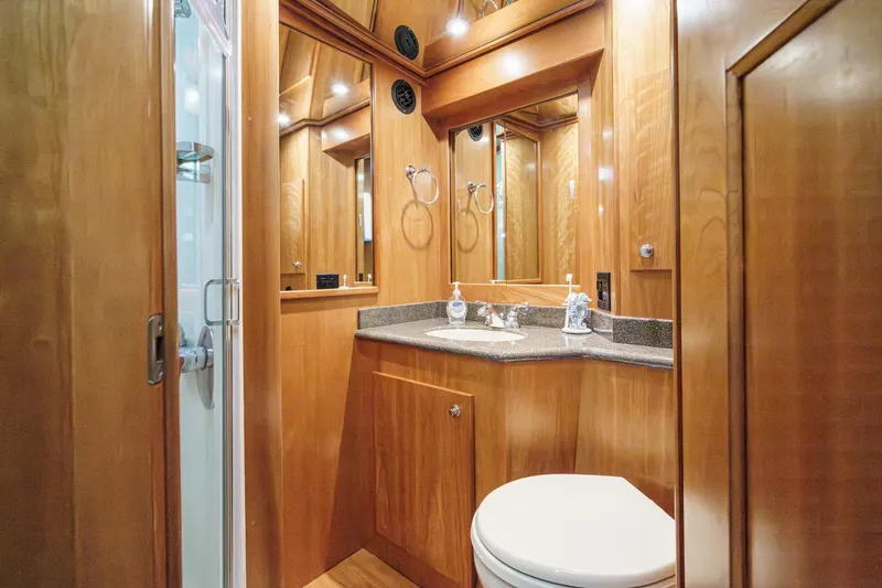 Carrin G Yacht Photos Pics Luxurious wooden bathroom interior in 2008 Navigator 4600 Pilothouse yacht.