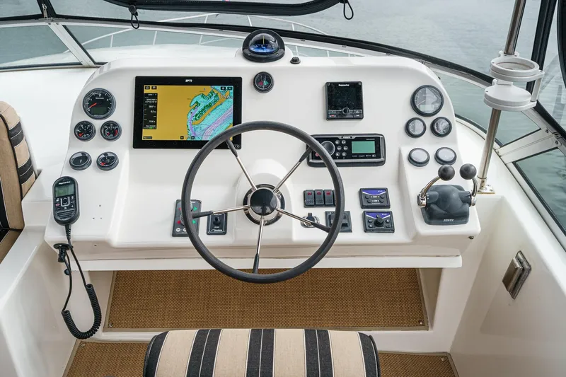 Carrin G Yacht Photos Pics Navigator 4600 Pilothouse 2008 helm with navigation instruments and steering wheel.