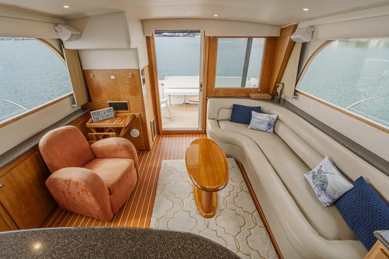 Carrin G Yacht Photos Pics Luxurious interior of 2008 Navigator 4600 Pilothouse yacht with plush seating and elegant decor.