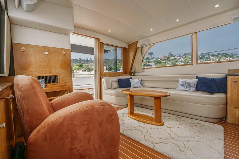 Carrin G Yacht Photos Pics Luxurious interior of 2008 Navigator 4600 Pilothouse yacht with plush seating and scenic views.