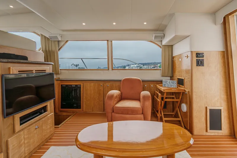 Carrin G Yacht Photos Pics Luxurious interior of 2008 Navigator 4600 Pilothouse yacht with plush seating and wood finishes.