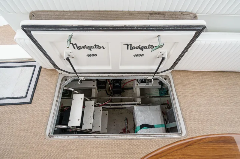 Carrin G Yacht Photos Pics Open hatch of 2008 Navigator 4600 Pilothouse showing interior storage compartment.
