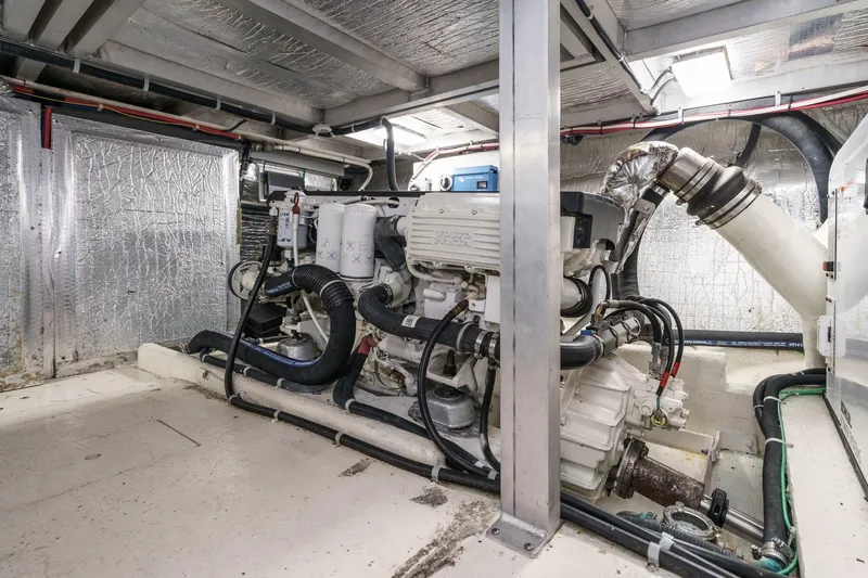 Carrin G Yacht Photos Pics Engine room of 2008 Navigator 4600 Pilothouse yacht, showcasing mechanical components and insulation.