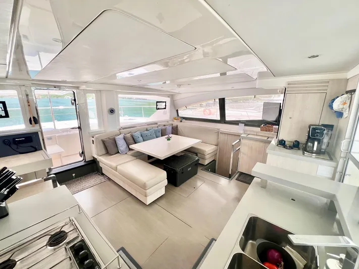 Jamsam Yacht Photos Pics Luxurious interior of 2017 Leopard 51 Powercat with modern kitchen and seating area.