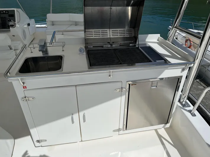Jamsam Yacht Photos Pics Outdoor kitchen on 2017 Leopard 51 Powercat with grill and sink.