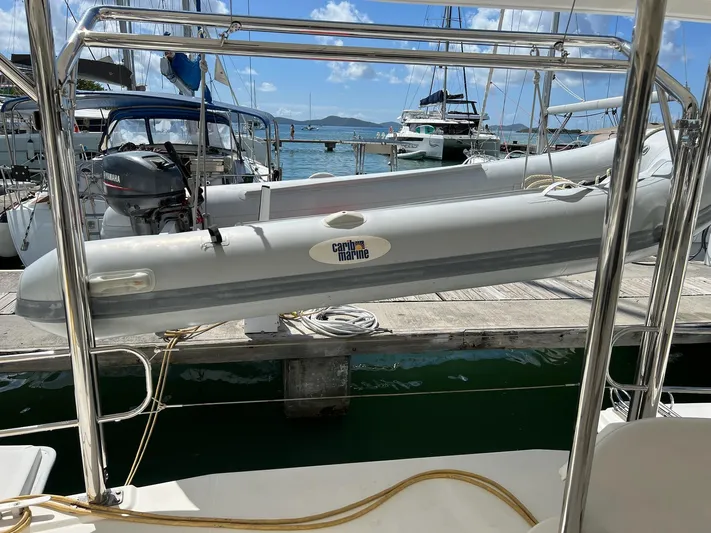 Jamsam Yacht Photos Pics 2017 Leopard 51 Powercat docked with inflatable boat, surrounded by other vessels.