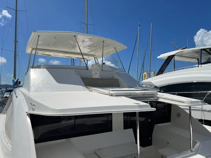 Jamsam Yacht Photos Pics 2017 Leopard 51 Powercat yacht docked under clear blue sky.