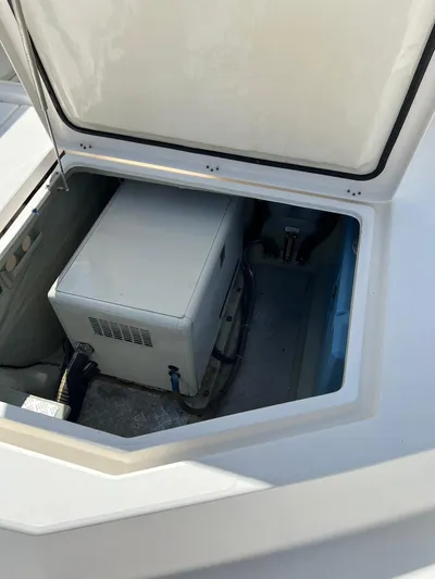Jamsam Yacht Photos Pics Open storage compartment on 2017 Leopard 51 Powercat boat, revealing equipment inside.