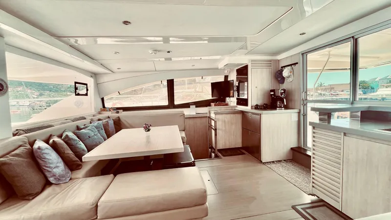 Jamsam Yacht Photos Pics Interior of 2017 Leopard 51 Powercat yacht with modern kitchen and seating area.
