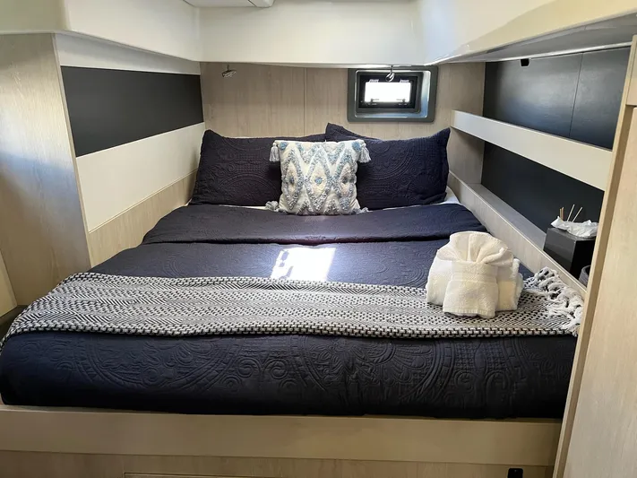 Jamsam Yacht Photos Pics Luxurious bedroom interior of 2017 Leopard 51 Powercat with elegant bedding and modern design.