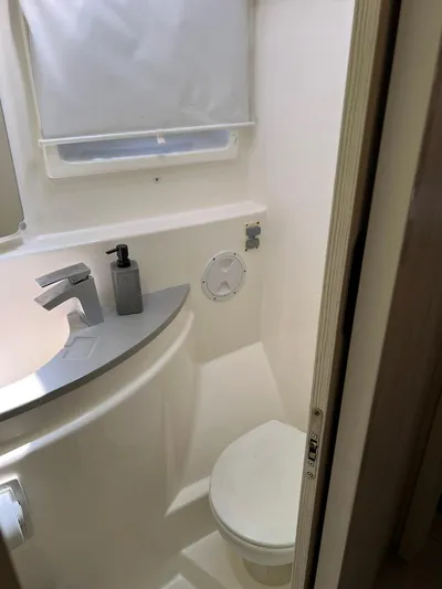 Jamsam Yacht Photos Pics Bathroom interior of 2017 Leopard 51 Powercat, featuring modern fixtures and compact design.