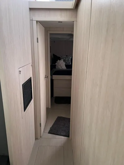 Jamsam Yacht Photos Pics 2017 Leopard 51 Powercat interior hallway with light wood finish.