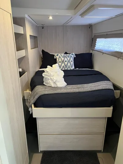 Jamsam Yacht Photos Pics Luxurious bedroom interior of 2017 Leopard 51 Powercat with modern decor and cozy bedding.