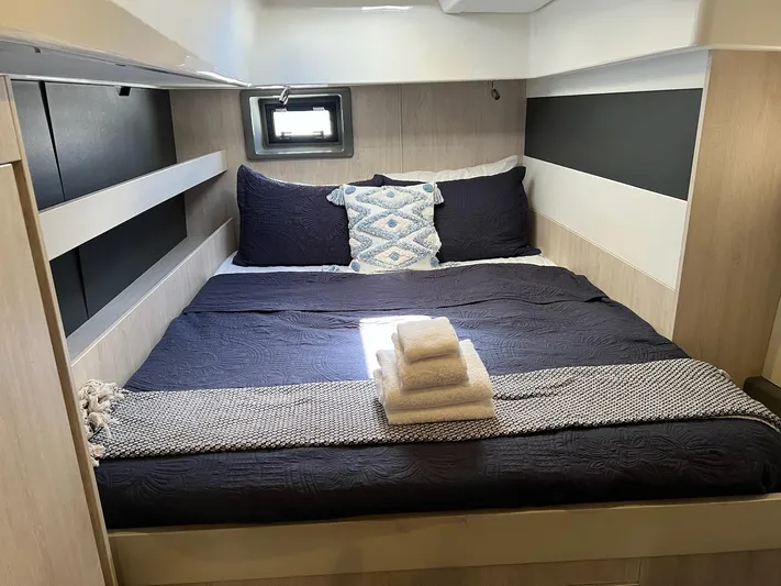 Jamsam Yacht Photos Pics Cozy bedroom in 2017 Leopard 51 Powercat with modern decor and window view.