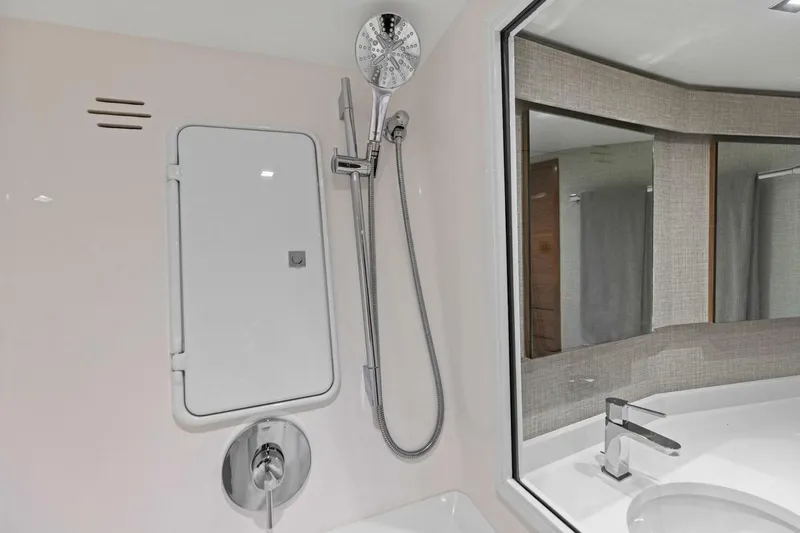 Olde Floridian Yacht Photos Pics Modern bathroom in 2023 Vikiing convertible with sleek shower and faucet design.